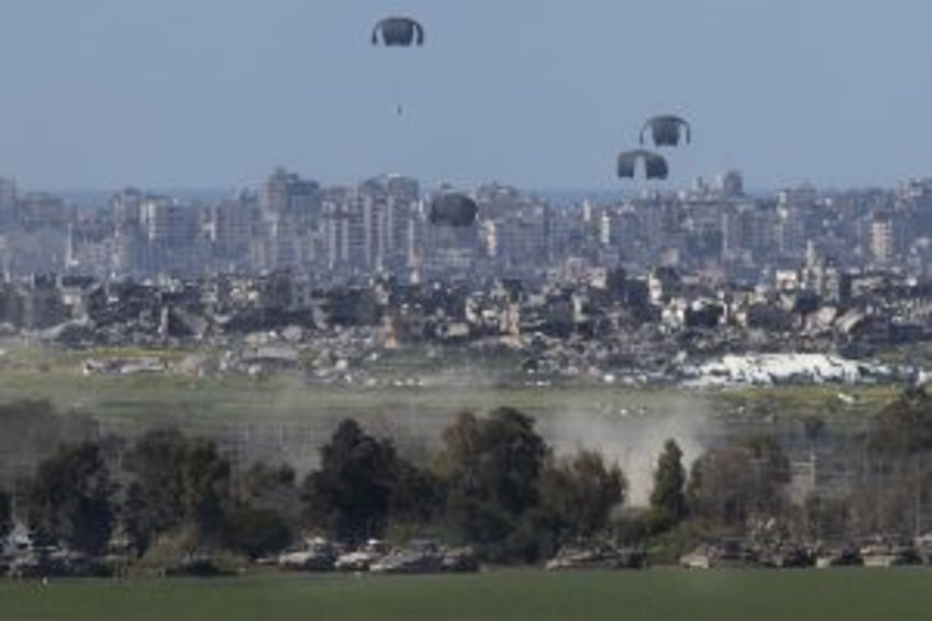 At least 20 dead, 150 wounded in attack on Gaza food aid site