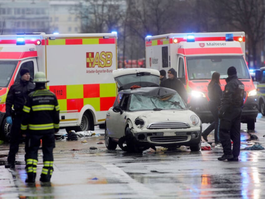 MUNICH, GERMANY - FEBRUARY 13: Police and emergency services operate near a damaged car th