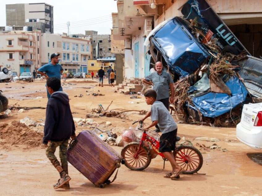 at least 2000 dead up to 10000 missing after dams burst in libya