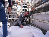 At least 23 people killed by Israeli strikes in Gaza as Israel lets minimal aid in