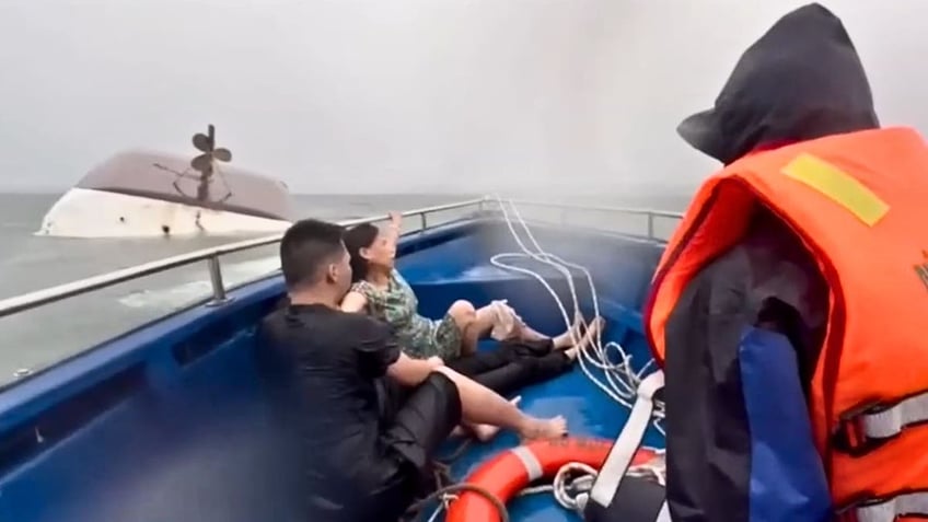 Survivors of the capsized boat in Vietnam are rescued.