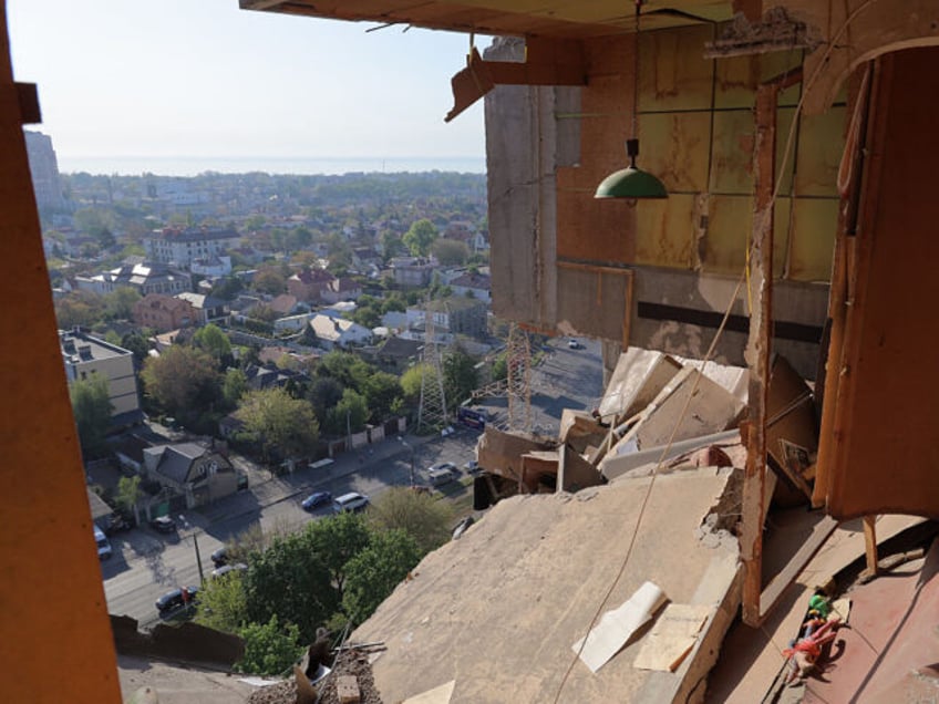 This photograph taken on May 1, 2025 shows a destoyed apartment in a residential building