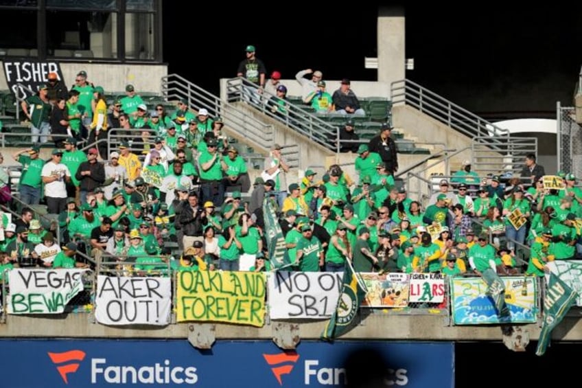 Oakland Athletics fans protest during a game against Tampa Bay Rays at the Oakland Coliseu