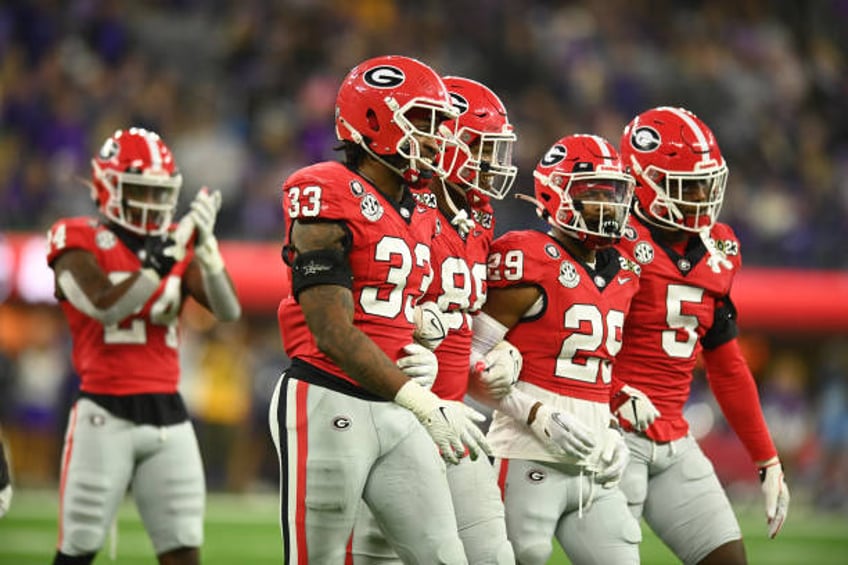 atlanta journal constitution fires reporter after making corrections to uga football abuse story