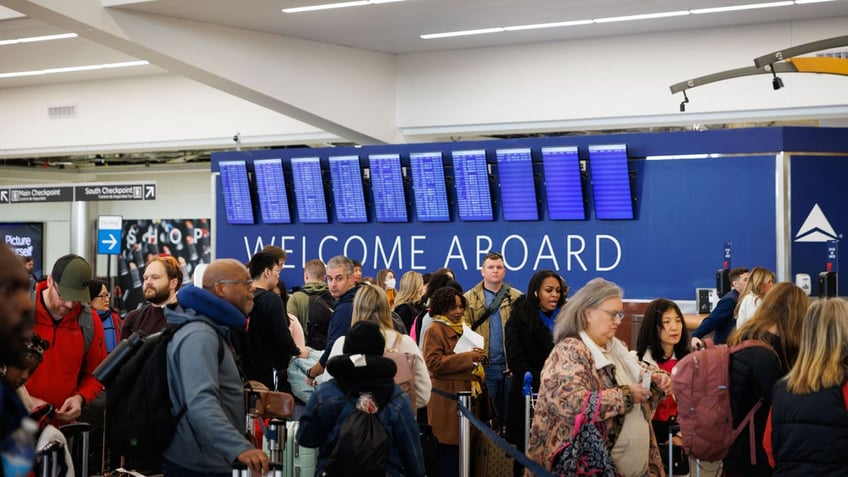 Travelers at Hartsfield-Jackson Atlanta International Airport