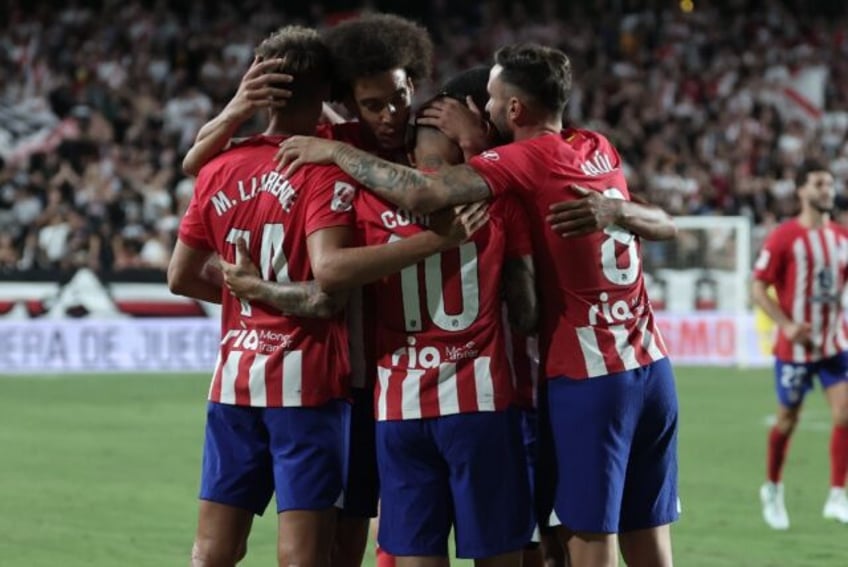 atletico crush dismal rayo in seven goal rout