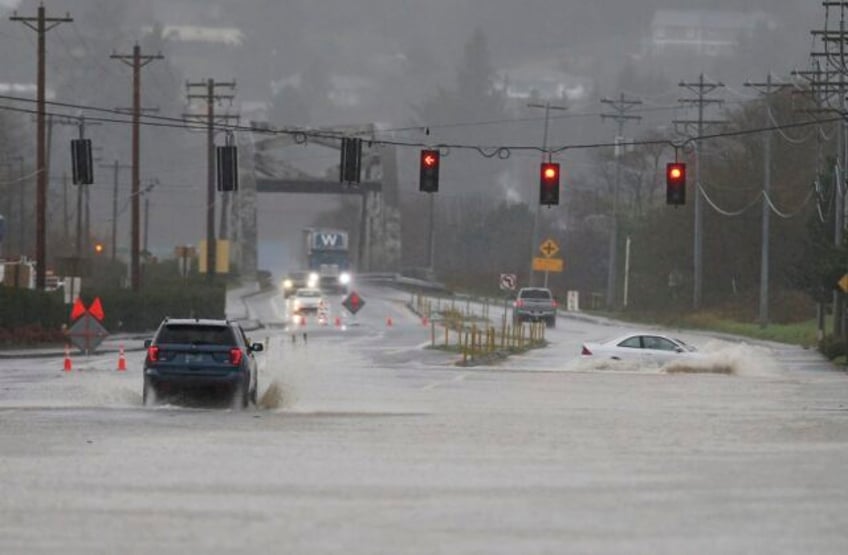 atmospheric river soaks pacific northwest with record breaking rain and unusually warm temperatures