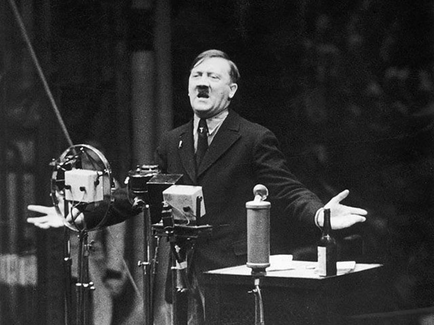 1935: Nazi leader Adolf Hitler speaks in front of microphones and gestures with his hands. Original Publication: From the newsreel 'The March of Time'. (Photo by Hulton Archive/Getty Images)