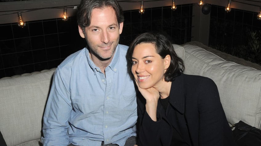 Jeff Baena, Aubrey Plaza on couch