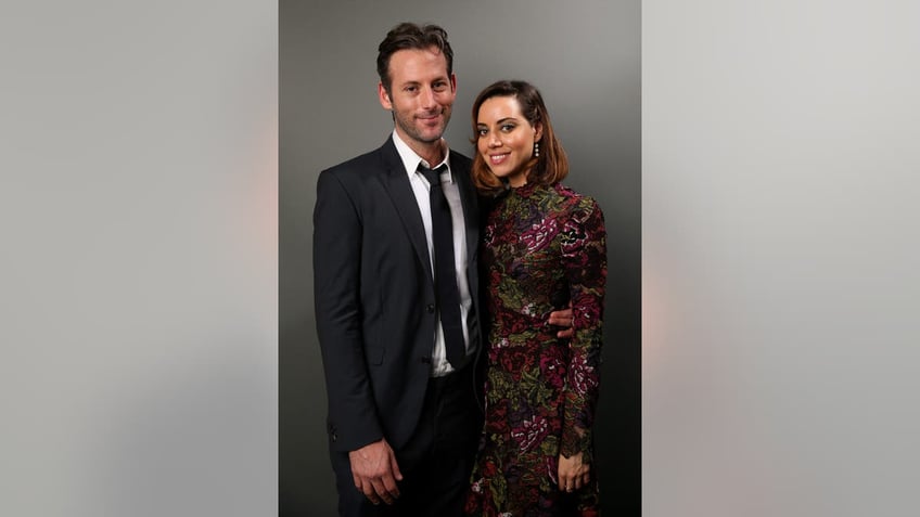 Jeff Baena and Aubrey Plaza pose for a photo