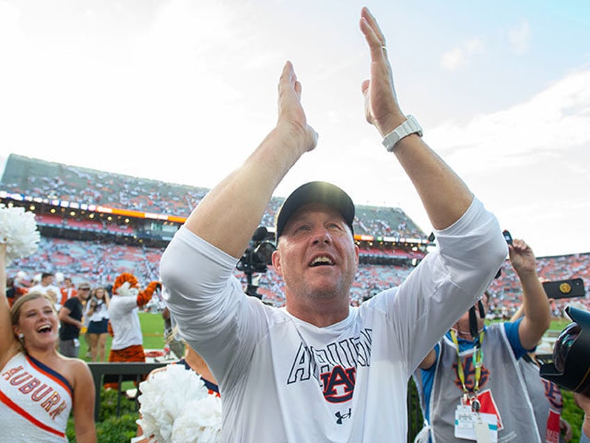 auburn coach hugh freeze baptizes freshman safety sylvester smith during mass worship event