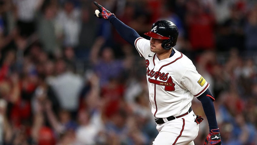 austin rileys clutch homer crazy game ending double play lifts braves over phillies ties nlds