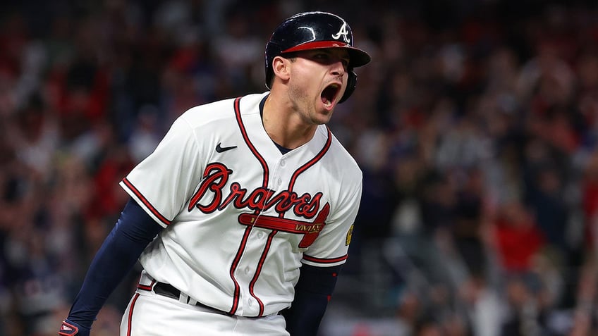 austin rileys clutch homer crazy game ending double play lifts braves over phillies ties nlds