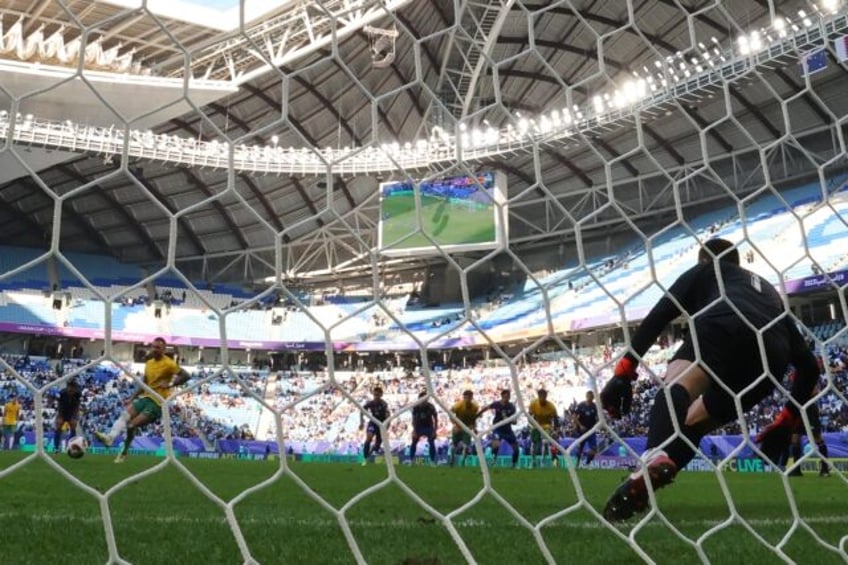 Australia's Martin Boyle shoots to score a penalty