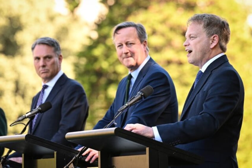 (L-R) Australia's defence minister Richard Marles, Britain's foreign secretary David Camer