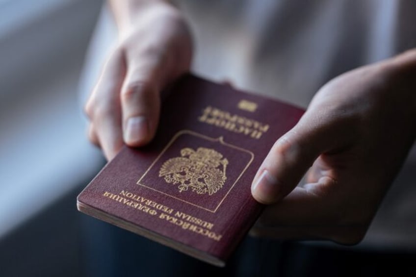 Australian police have charged a married couple - both holders of Russian passports - with