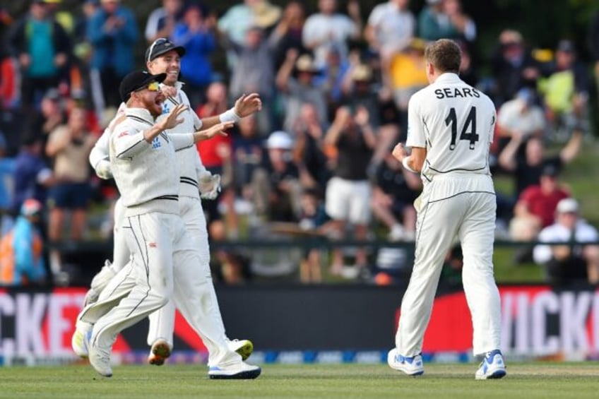 New Zealand seamer Ben Sears (R) celebrates the wicket of Australia batsman Cameron Green