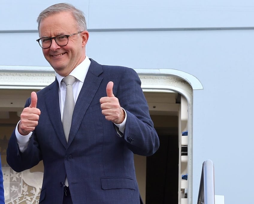 CANBERRA, AUSTRALIA - MAY 23: Prime Minister Anthony Albanese stands with newly appointed Foreign Minister Penny Wong, at the door of their plane on May 23, 2022 in Canberra, Australia. Albanese is travelling to Japan to attend the QUAD Leaders' meeting in Tokyo. Albanese was sworn in as Australia's 31st prime minister on Monday morning following his victory over Scott Morrison in the federal election on Saturday. (Photo by David Gray/Getty Images)