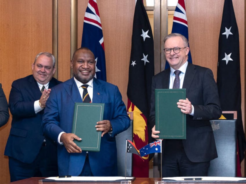 australia pushes against chinese influence signs pact with papua new guinea