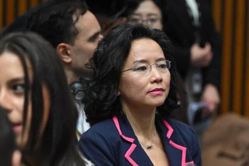 Australian journalist Cheng Lei observes a signing ceremony by China's Premier Li Qiang an