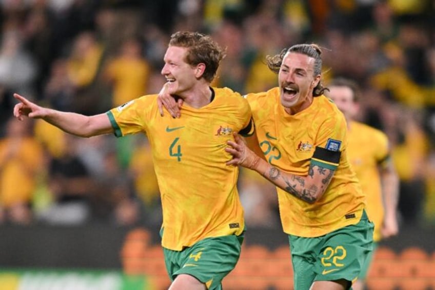 Australia's Kye Rowles celebrates scoring against Lebanon