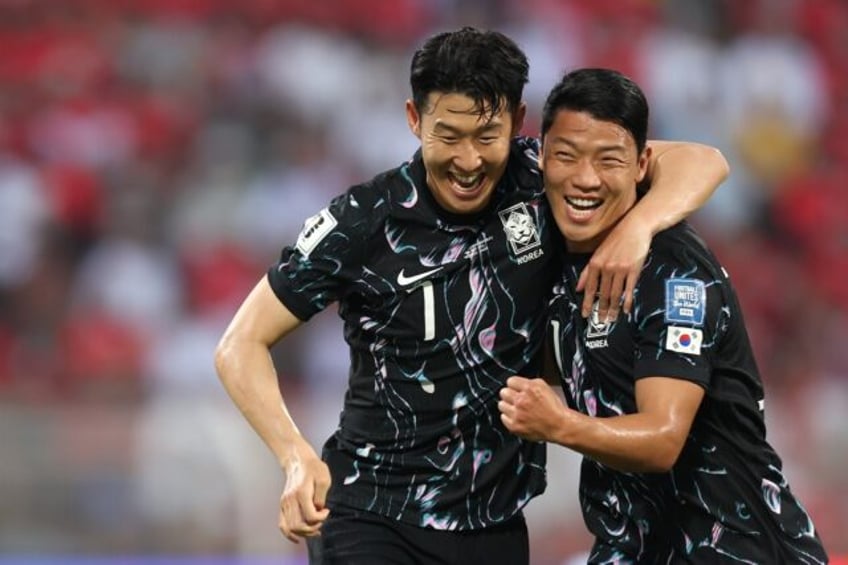 South Korea's Son Heung-min (left) celebrates after Hwang Hee-chan (right) scored against