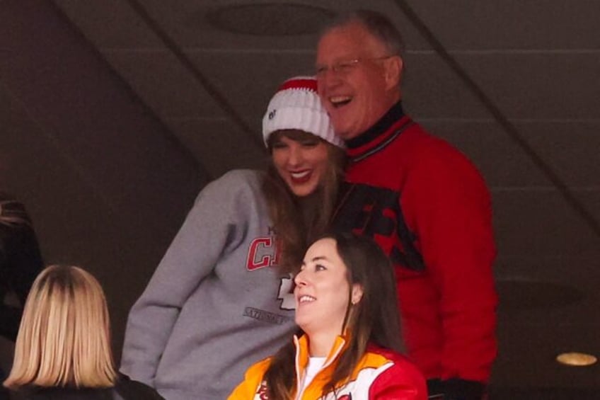 Scott Swift (top R), seen taking in an American football game with daughter Taylor Swift (