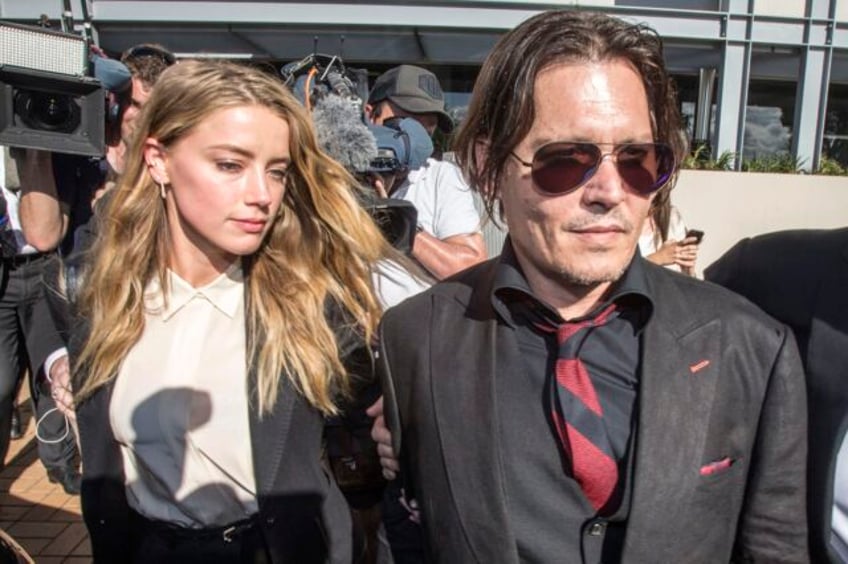 australian prosecutors drop case against actor amber heard over pet yorkshire terriers