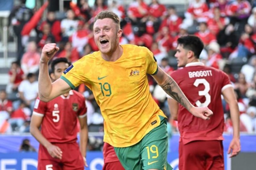 Harry Souttar celebrates scoring Australia's fourth against Indonesia