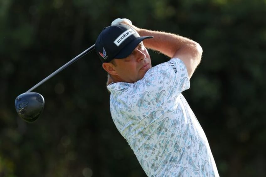 American Gary Woodland plays a shot in his return to the US PGA Tour at the Sony Open in Hawaii less than four months after undergoing brain surgery