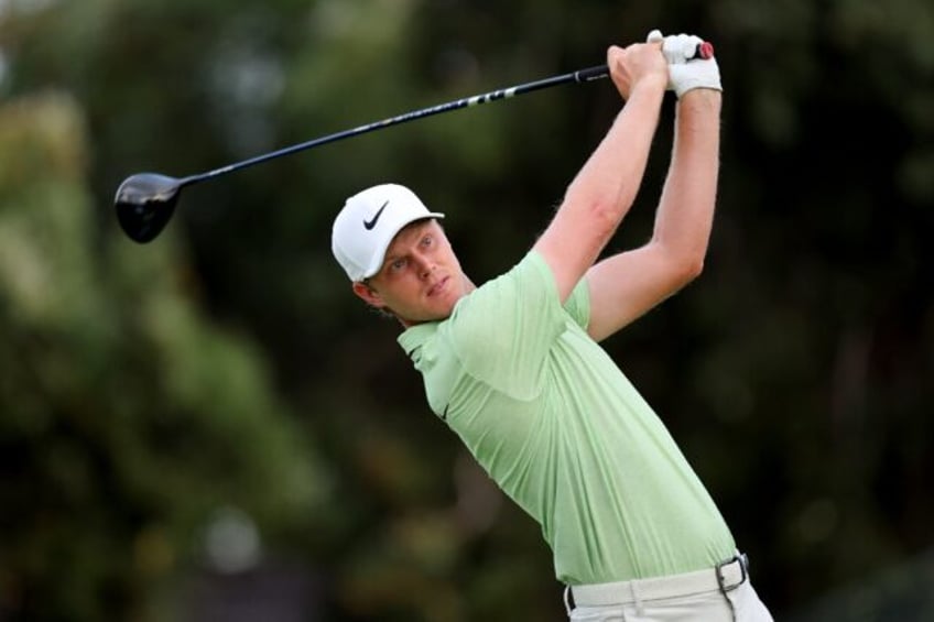 Cameron Davis of Australia remained atop the leaderboard after Friday's completion of the darkness-halted first round of the Sony Open at Honolulu