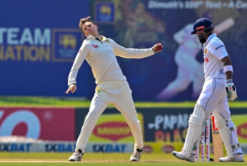 Australia's Matthew Kuhnemann (L) has been reported for a suspect bowling action