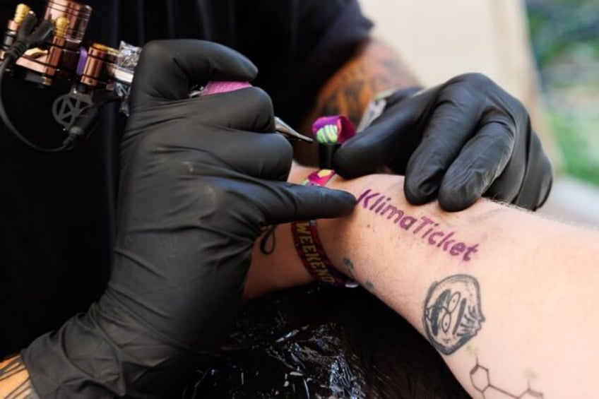 austria says wont repeat transport pass for tattoo campaign