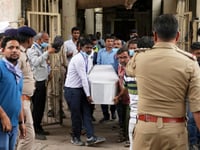 Authorities investigate one of India’s worst aviation disasters as Modi visits the site