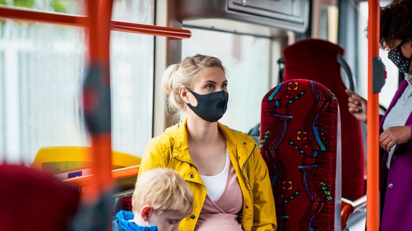 Pregnant woman on bus