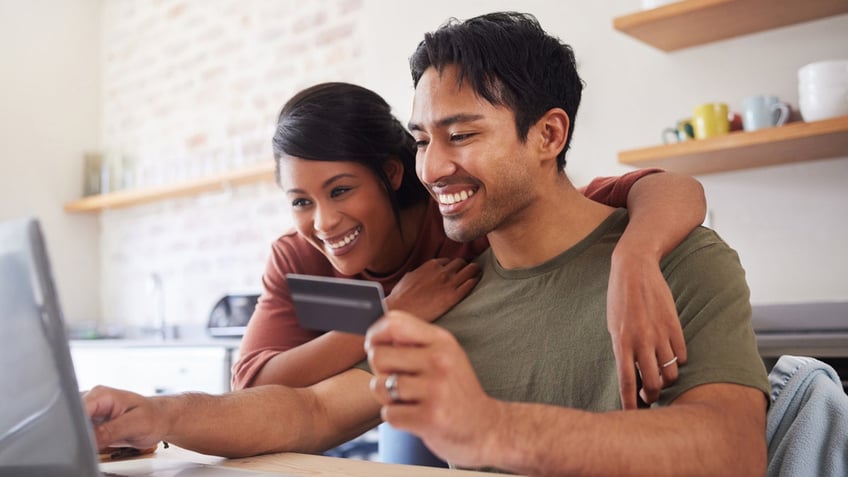 couple making a donation online