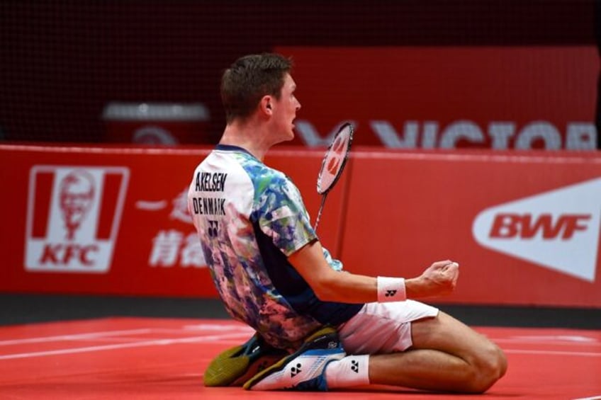 Denmark's Viktor Axelsen celebrates after beating China's Shi Yuqi in the men's singles final of the BWF World Tour Finals in Hangzhou