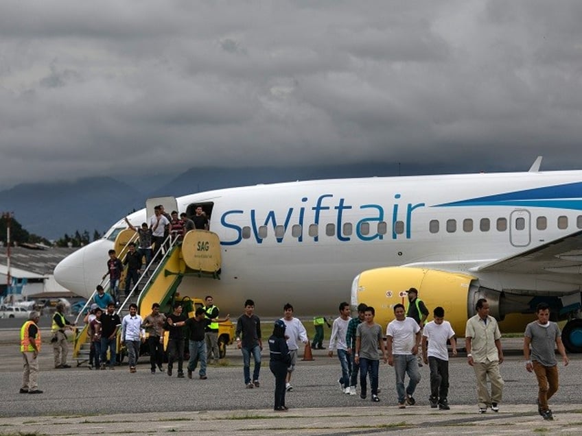 GUATEMALA CITY, GUATEMALA - MAY 30: Guatemalan men walk from a deportation flight, chartered by the U.S. Government, after being sent back from the United States on May 30, 2019 in Guatemala City, Guatemala. U.S. Immigration and Customs Enforcement (ICE) deports some 2,000 people per week to Guatemala from various U.S. cities. (Photo by John Moore/Getty Images)