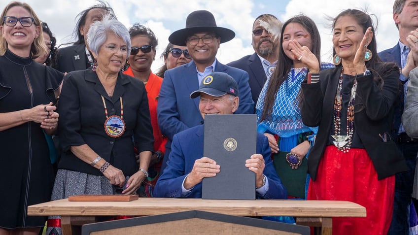 President Joe Biden smiles after signing a proclamation designating the Baaj Nwaavjo I'Tah Kukveni National Monument