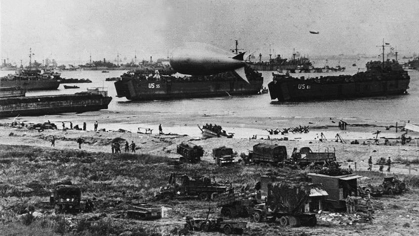 US troops disembark from landing crafts during D-Day