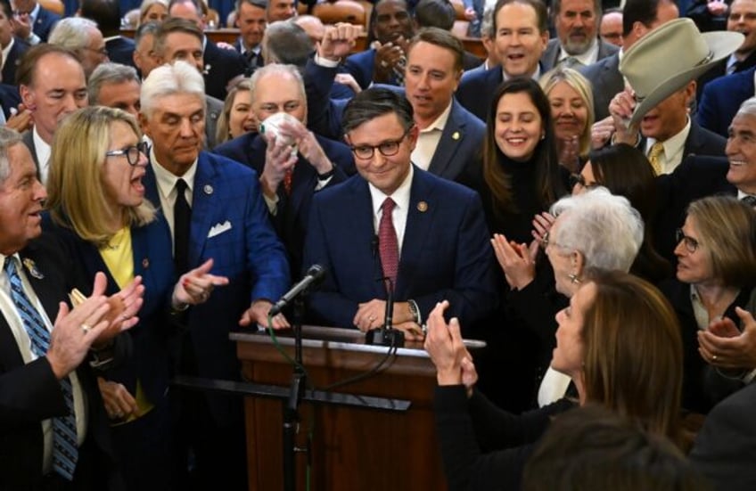 Mike Johnson (center) is applauded after being nominated Republican speaker of the US House of Representatives on October 24, 2023