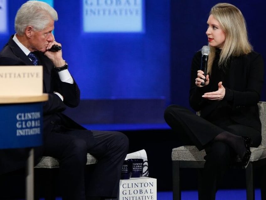 Theranos fraudster Elizabeth Holmes talks with Bill Clinton