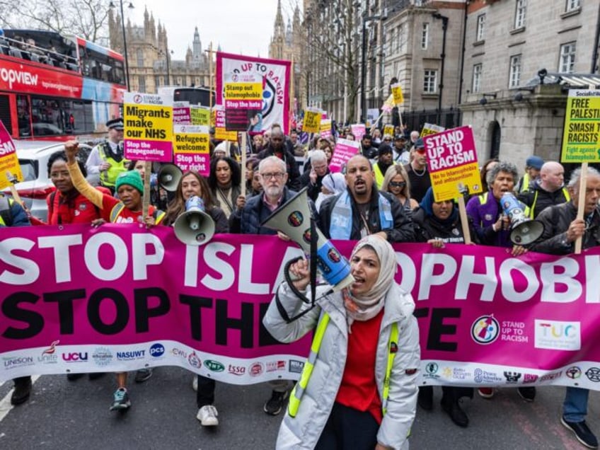 Anti-racism activists take part in a Stop Islamophobia Stop The Hate march on 16th March 2