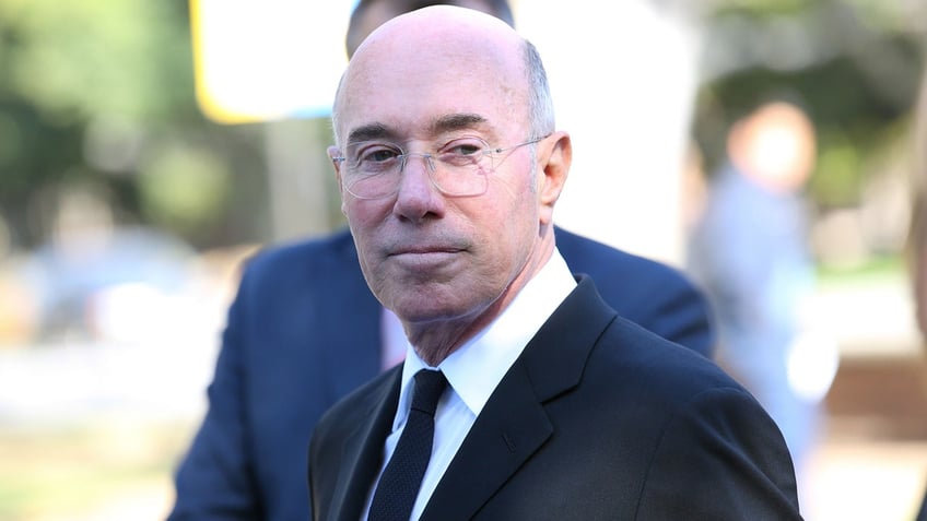 David Geffen takes a photo