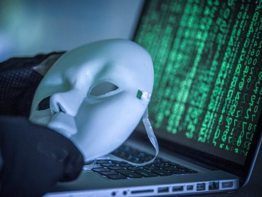 Hack holding a mask