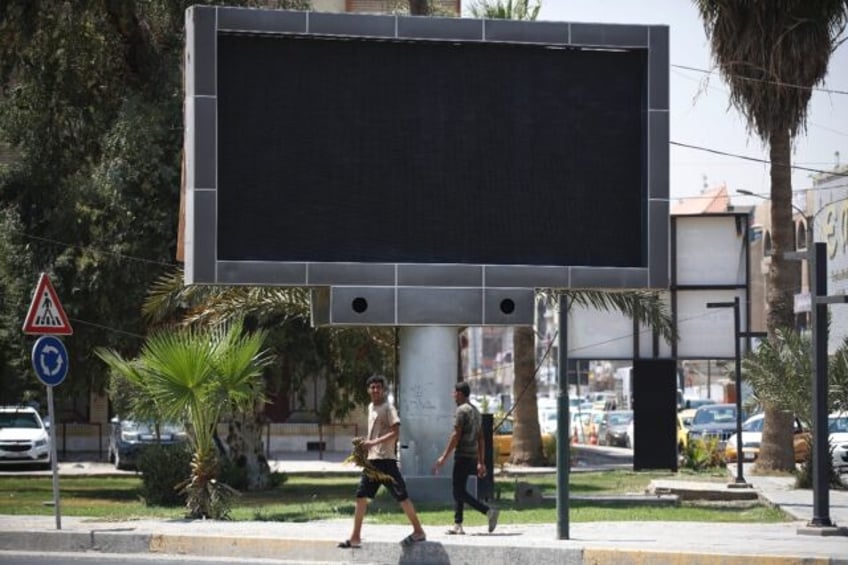 baghdad shuts advertising screens after porn screening