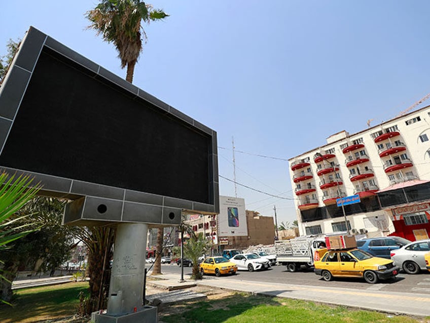 baghdad shuts down advertising screens after hacker posts porno