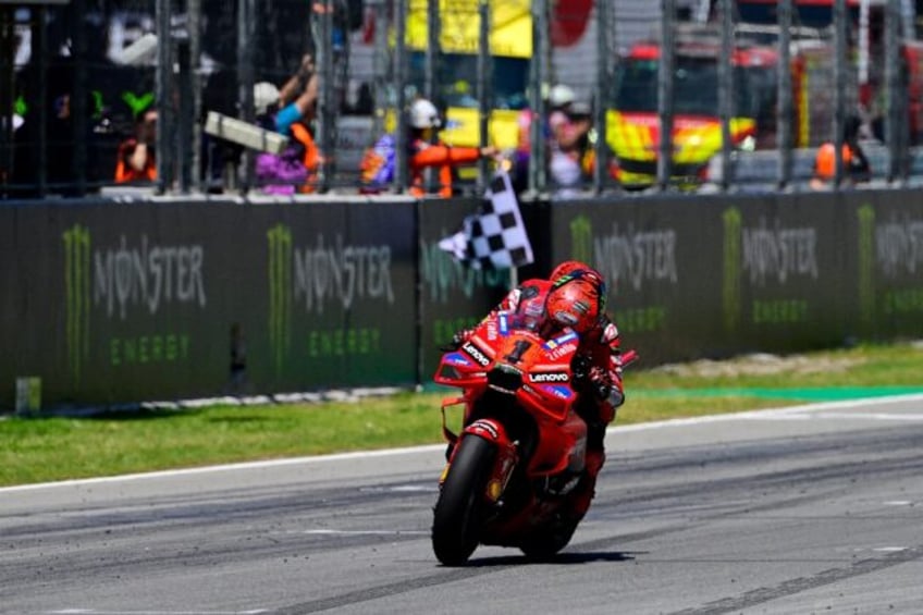 Francesco Bagnaia taking the chequered flag in Catalunya last weekend