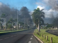 ‘Balaclavas and big sticks’: New Caledonia tourists trapped by riots