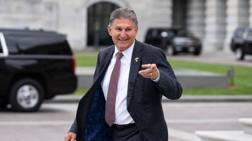 Manchin points and walks by Capitol